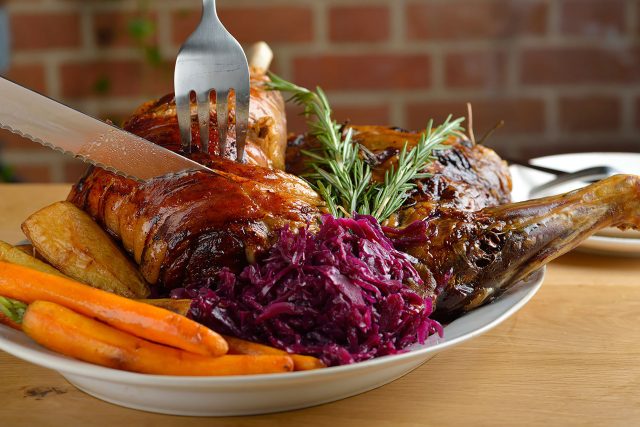 Families enjoying a traditional three-course Sunday lunch at Aqua Bar and Grill.